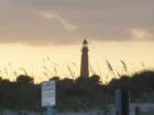 Sunset behind the Ponce Inlet lighthouse. I've seen a lot of photos of this lighthouse, most of which all look the same. But I've never seen one with this uniquely colored sky as the sun set and a storm rolled in.