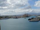 Super Ferry cruises past container ship piers