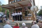 Barbershop Quartet (The Dominion 4) entertaining on the porch of The Corner Store.