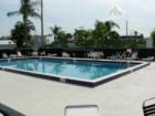 Here is a photo of the Pool at Villas on the Green. Shall we go for a swim?