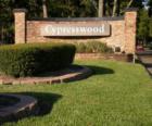 Entrance to the wooded subdivision of Cypresswood in Spring TX