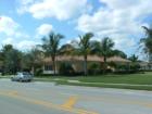 Here is a photo of the front side of the Tuscany, Abacoa, Jupiter, Florida Club House/Post Office. Lots of Palm Trees! See if you can spot the tower on the back side of this building.