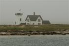 Old lighthouse on a foggy morning