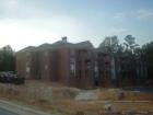 Stacked flats at Ramblewood w/elevators and garages that are  under construction in Ramblewood at North Hills.   