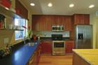 Original two bedroom sales model of Palmaire Condominiums, Phoenix, AZ.  Kitchen featured honed (matte finish) slab granite, European style cabinets, stainless appliances, upgraded lighting, bamboo floors and more.