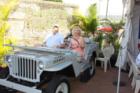 Vacationing Florida Real Estate Agent and wife pretend to drive vintage WWII jeep...