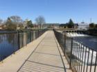 Walkway over Rogue River Dam in Rockford Michigan