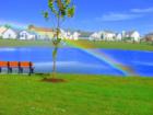 Rainbow created over Hilmar Park Pond as Genoa Twp Firefighters test their spray nozzles