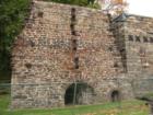 across the street from the foundry, next to the church