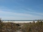 Holden Beach, North Carolina, boasts wide beach strands.   Find your way through the protected dunes to white sandy beaches.