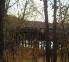 Old rail road bridge through the trees off of route 20