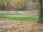 View of the 15th green at the Atkinson Resort and Country Club. This is taken at the curve in the cart path over looking the down slope of the fairway.