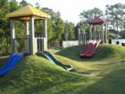 New playground featuring hillside slides, a winding trike path, and much, much more!