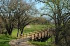 A bridge spans a creek on the golf course at Eagle Ridge.  The natural beauty of this place is amazing.