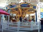 Venetian Carousel from Italy sits outside the entrance to Macy's department store at the Sacramento Westfield Downtown Plaza. The carousel business was established in 2005. Open 10 AM to 9 PM, M-F & Sun. 11 AM to 6 PM. Adults can ride free with kids.