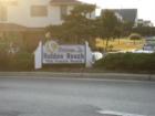 HB welcome sign at base of bridge.