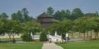 Family playing in the gazebo at Carpenter Village.  This neighborhood has plenty of open space, walking trails, and a lake too!