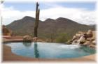 Hilltop home on 4.75 acres. 360 degree mountain views, 4094 sq ft with 3 bedrooms and a den. High end quality and design. $2,175,000