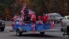 Kids on a float with lots of flags - that helps make a community parade