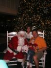 Sitting with Santa at the Cape Christmas Festival on Cape Coral Parkway.