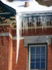 Ice hanging off the roof of a grand historic home on Summit Avenue in St Paul