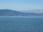 Sausalito with a sail boat in the foreground as seen from the Larkspur Ferry.