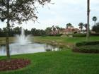 A view of the clubhouse and pond fountain at the resort