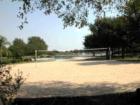 Cinco Ranch Beach Club has a real sand vollyball court & sand surrounding the pool  where the little ones can build sand castles, just like going to the beach. Lg covd. pravillion, out-door showers, shade trees, picnic  tables.