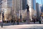 Landmark sculptures at the corners of Trade & Tryon 