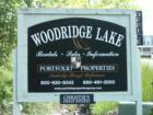 Portfolio Properties Group sign, at Woodridge Lake in Goshen, CT