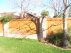 A stately cedar fence that provides good privacy from a side street.