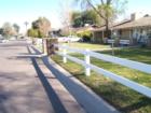 A split rail fence anchored with brick posts.