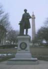 Statue of Severn Teackle Wallis on the eastern edge of Mt. Vernon Square.  The Washington Monument is in the Background.