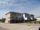 the back of the homes at campeche shores all feature one or more decks.. some are bayfront and others face the golf course