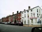 Baltimore has many inner-city neighborhoods with blocks upon blocks of row houses, many with white marble steps, and many covered with "Formstone".