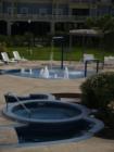 Hot tub and kiddie splash area... with lots of tables and chairs... a true resort! 