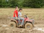 My daughter and friend riding on 4 wheeler on friends land when muddy.