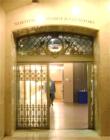 Deco grill work around door leading to the elevators