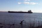Barge passing heading north past Fox Point State Park on the Delaware River North of Wilmington