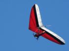 A hangglider soars with a friendly air current.
