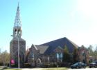 Christ United Methodist Church at Southern Village is a beautiful stone church with archways reminiscient of classic European architecture.