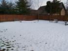 Snow covered rear yard of 611 East Charlotte Street, Sterling