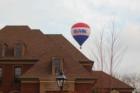 Hot air balloon rising over house in new subdivision being built at the end of Granny White Pike.