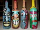 Terri Beiber's colection of painted bottles by famous local artist, Terri displayed them at the Cinco Ranch Ladies Club meeting of "For the love of art & Chocolate", Photo by Liz Carter