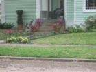 One of the vintage homes in Smithville celebrating spring time with lots of colorful flowers!