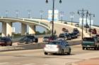 Broadway Bridge (International Speedway Bridge). The Broadway Bridge reaches a height of 65 feet (19.9 m) and is 3,008 feet (917 m) in length. The bridge is famous for its mosaics of manatees, dolphins and other wildlife native to Florida. 
      
      
      