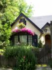 Front of a storybook style bungalow on Elmwood Court in Modesto