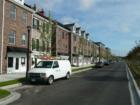 Looking down the street lined with Live/Work Town Homes