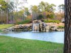 Entrance to the exclusive gated community of The Falls at Champion Forest in Spring Texas