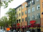 New building with restaurants and small shops located on Main St in Downtown Naperville